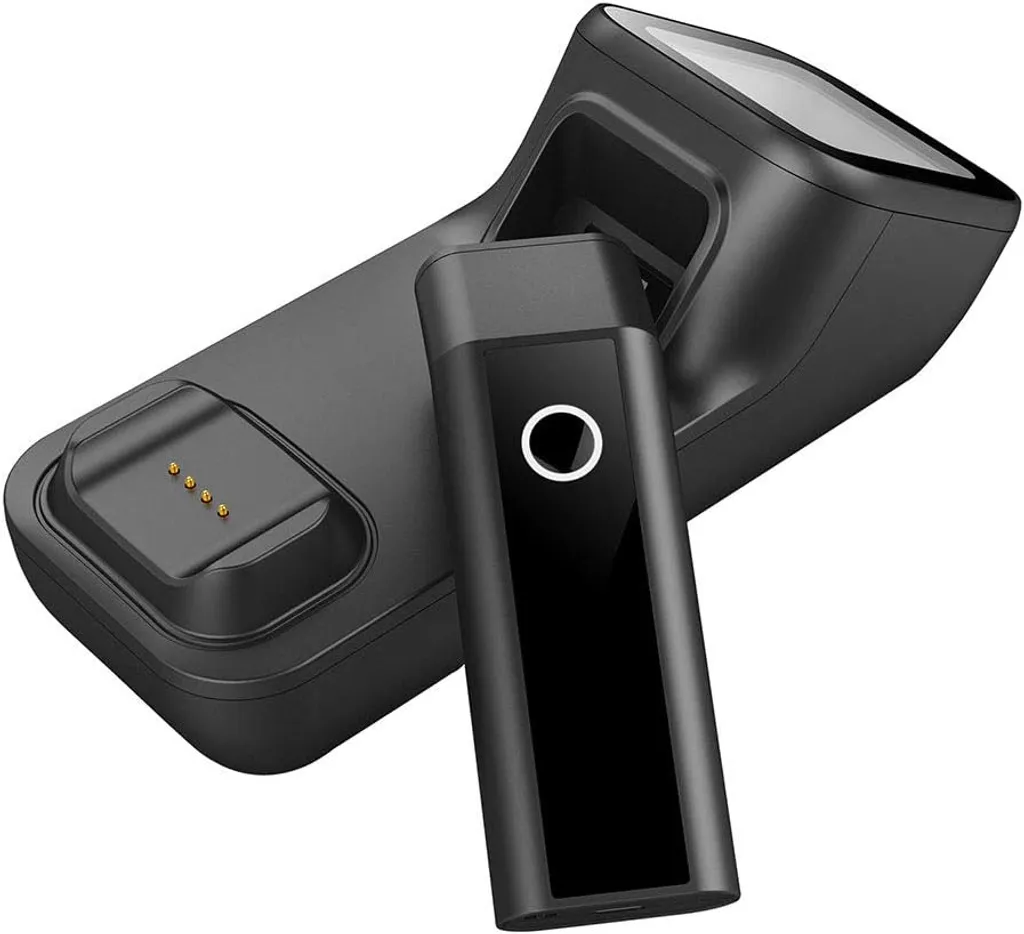 The Alacrity Bluetooth barcode scanner sitting in its dock on a desk, with the dock providing continuous scanning when an attendee taps their pass against it.