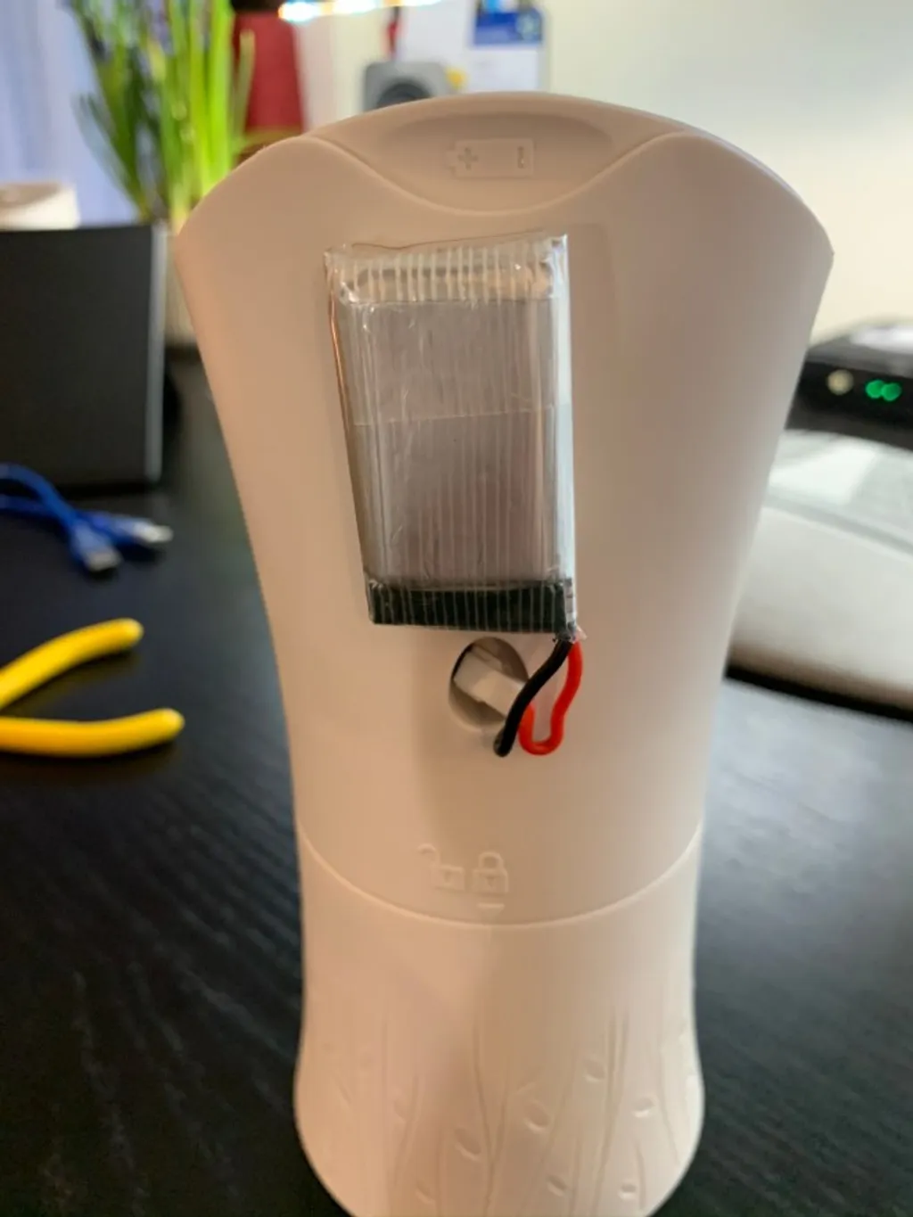The back of the Airwick unit with a small 18650 battery pack attached for ease of access during the prototype.