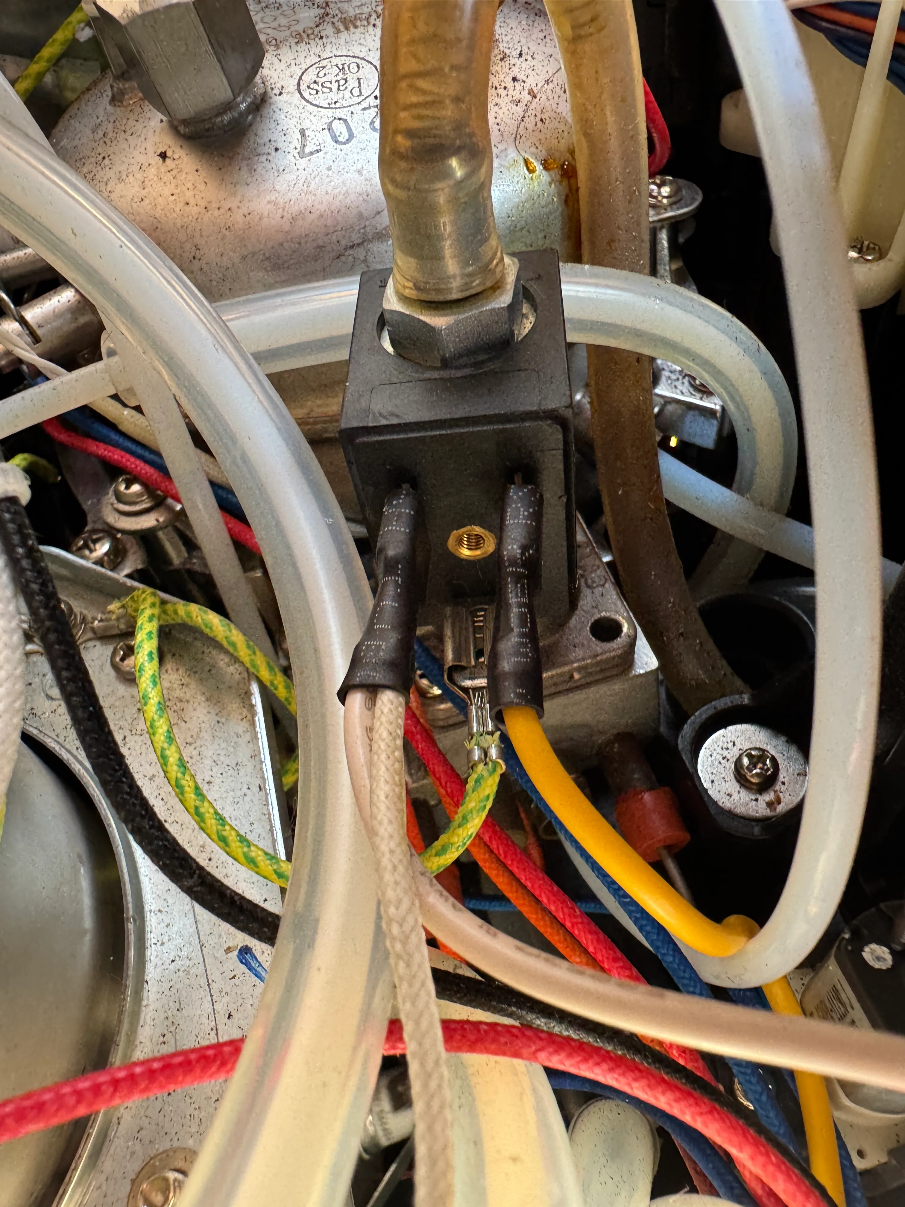 Accessing the faulty solenoid valve inside the machine.