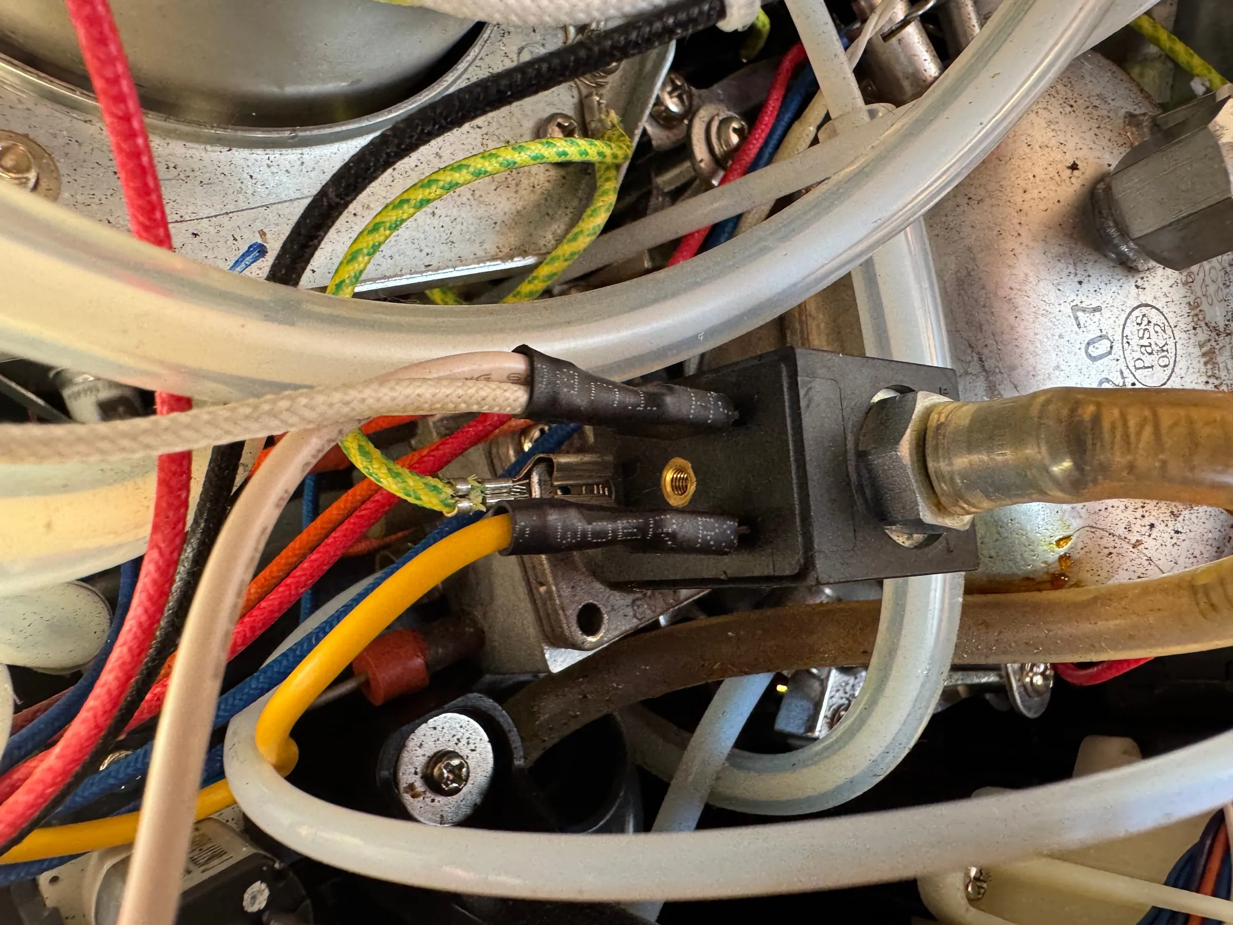 Accessing the faulty solenoid valve inside the machine.